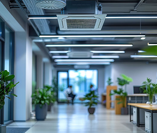 an office with ceiling mounted air conditioning units